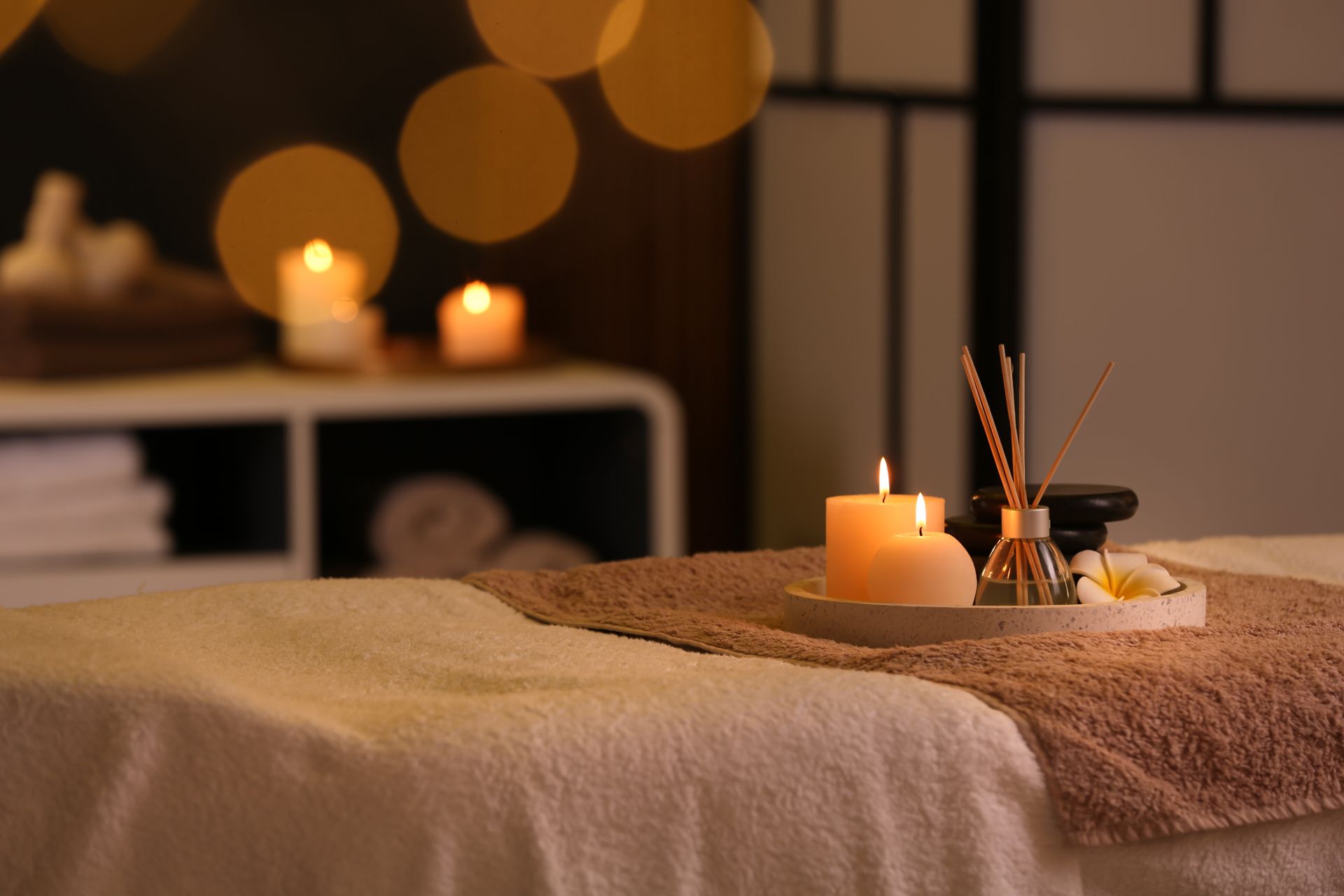 Candlelit spa treatment setup